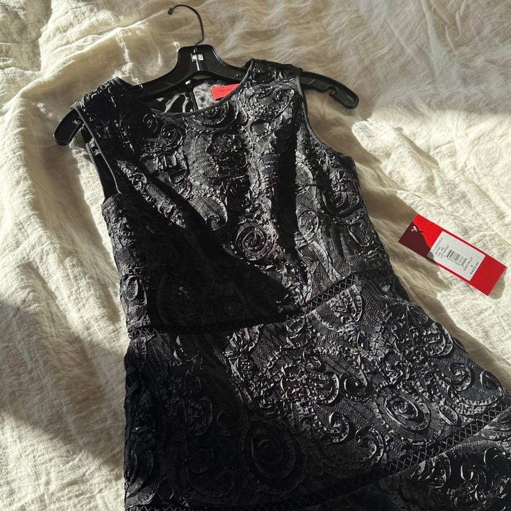 Never been worn Carmen Marc Valvo, size 4